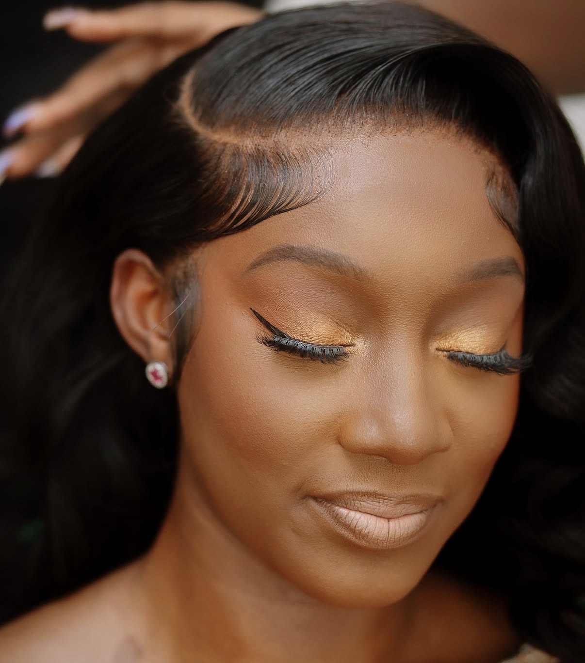 Close-up of a flawless melted lace hairline by Bekah